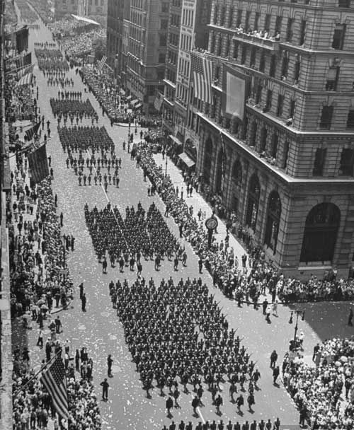 "Columns of US soldiers marching in Independence Day parade up Fifth Avenue." July 04, 1942